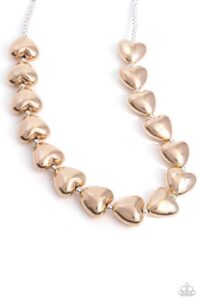 Infused along a classic silver chain, sleek gold hearts alternate with dainty silver beads along the neckline for a romantically refined statement. Features an adjustable clasp closure.

Sold as one individual necklace. Includes one pair of matching earrings.